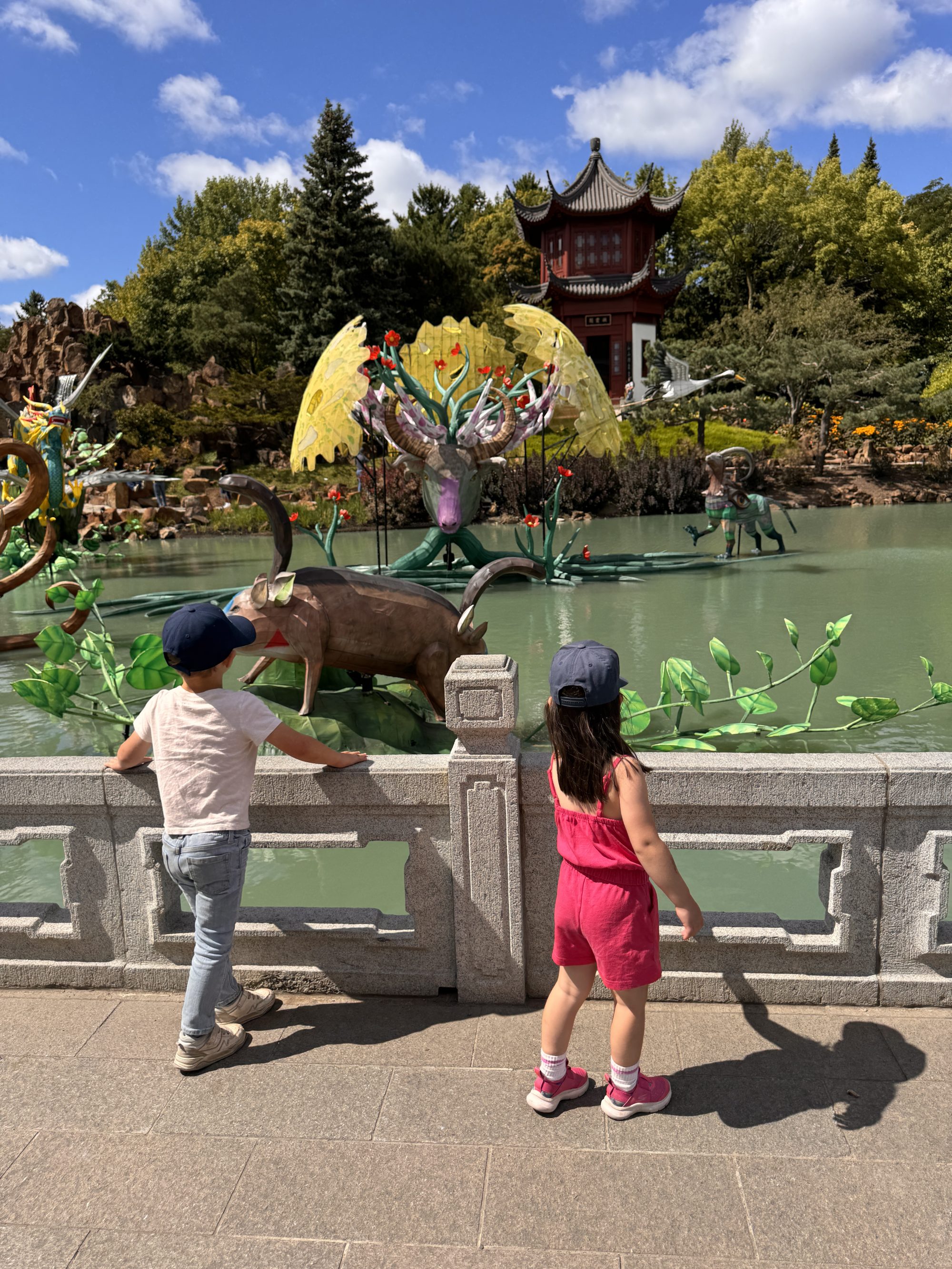 Two children exploring the Montreal Botanical Garden, a family-friendly destination for autism families.